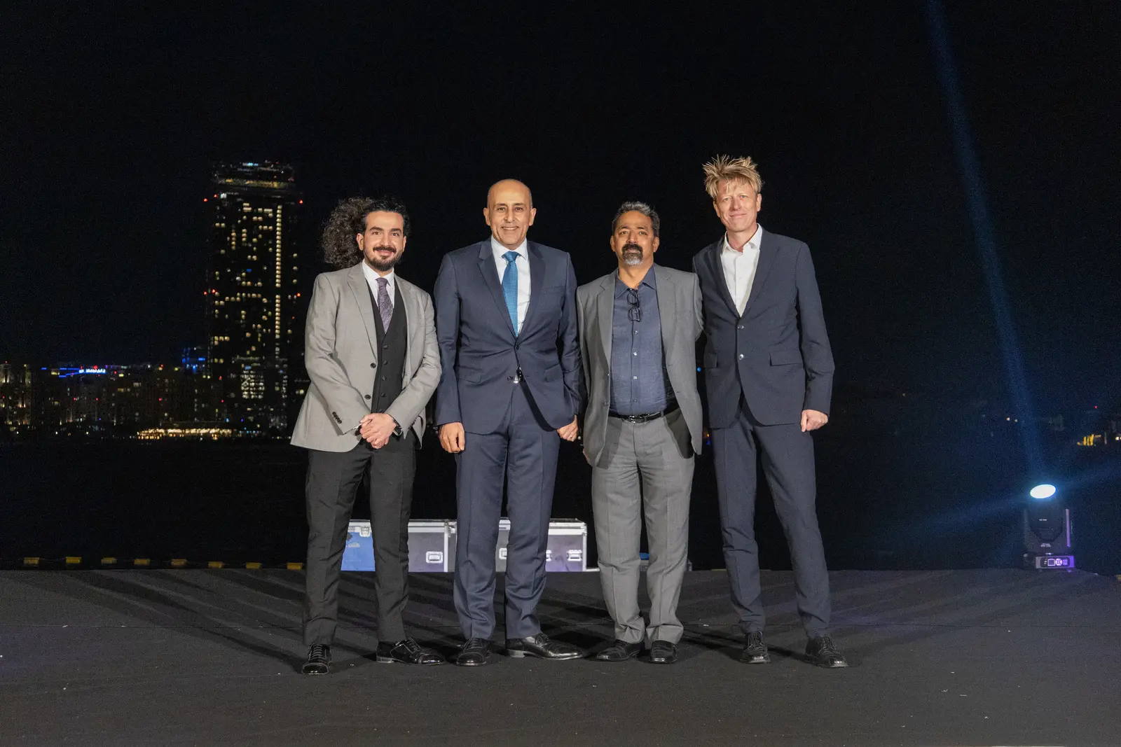 Danfoss gala stage moment against the Dubai skyline